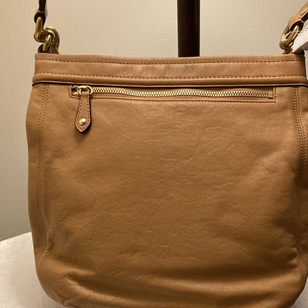 This is a coach leather bag with a shoulder strap and a carry handle - Picture 3 of 6